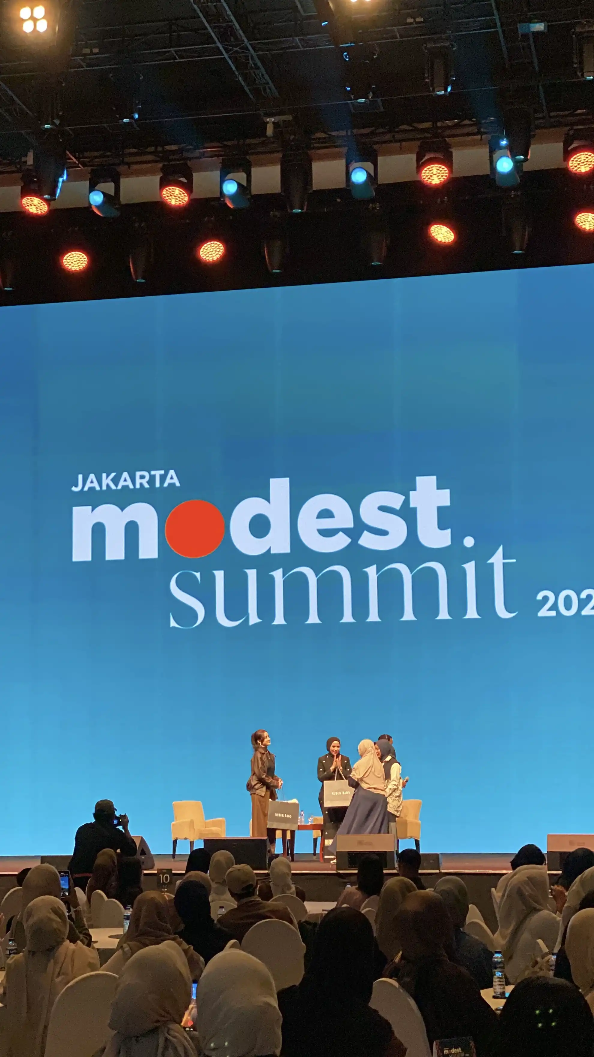 Jakarta Modest Summit 2026 stage with panelists greeting each other after the session